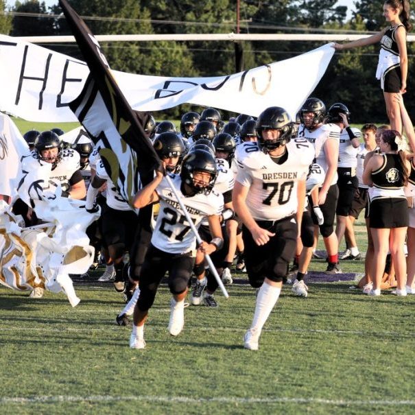 The Dresden football teams runs out before playing Trinity Christian Academy in Week 1 of the 2026 season.