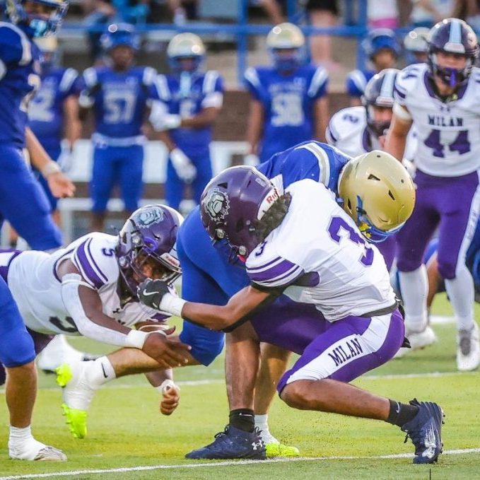 Milan's Ty Hollingsworth (3) and Trinden Kirby (5) combine for a tackle against Huntingdon during a Region 7-2A high school football game at Paul Ward Stadium on Sept. 4, 2026. Photo by Carrie Hurt.