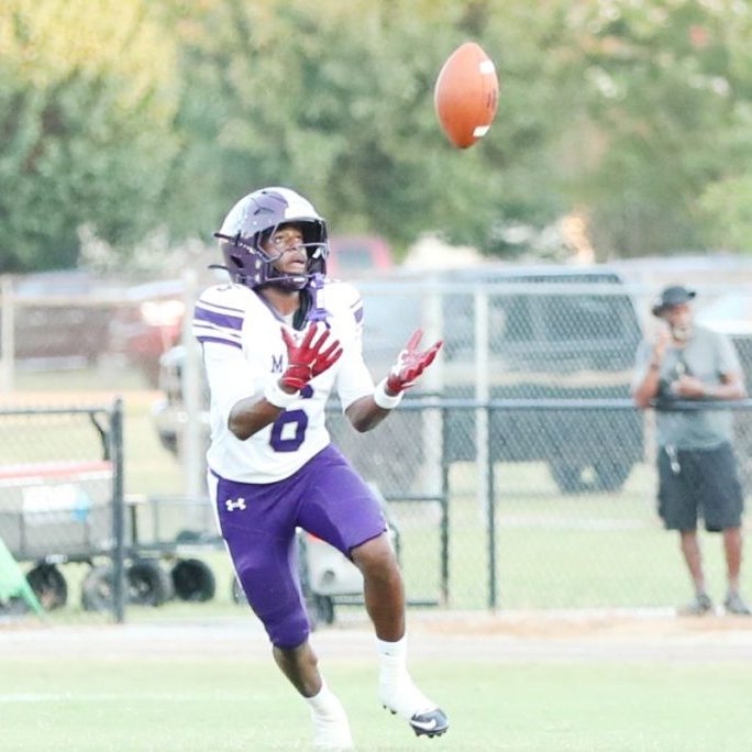 Milan's JT Conley (6) catches a kick against South Side during a Week 1 high school football game at South Side.